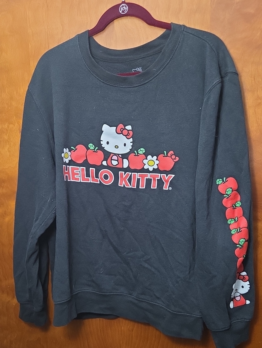 Hello Kitty Black Sweatshirt with Red Apple Graphics